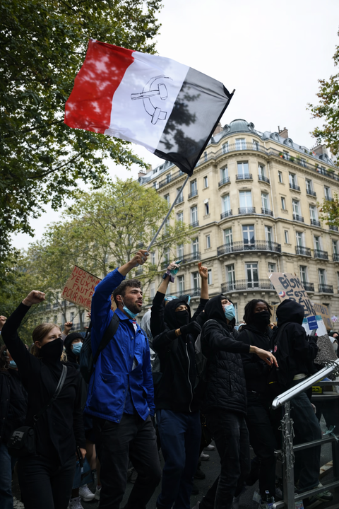 French police deploy tear gas and water cannons as more than 400,000 protestors hit the road